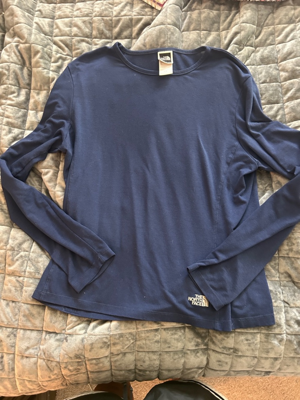 The North Face Navy Long Sleeve Crew Polyester and spandex!